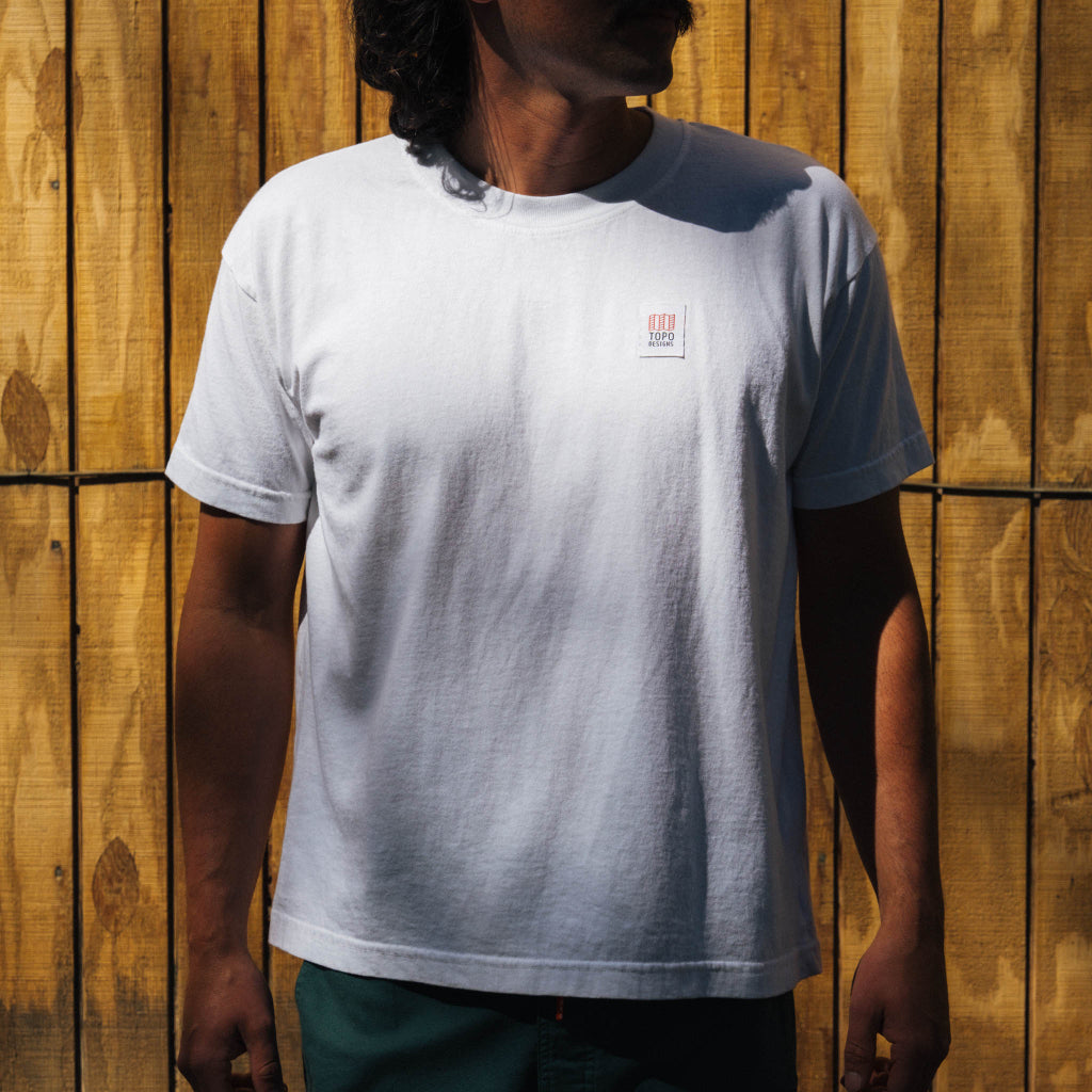 Front lifestyle image of Topo Designs x Soft Goods Label Tee in "White"