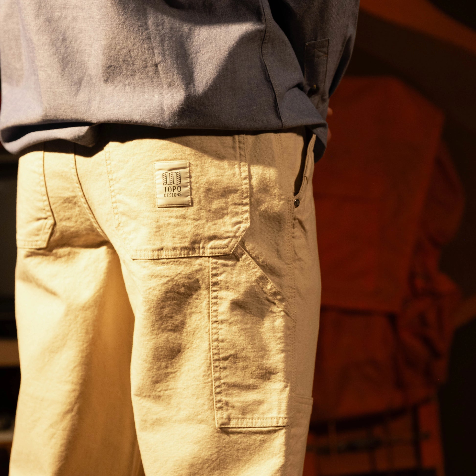 General model shot of Topo Designs Utility Pants Undyed - Men's in "Undyed"