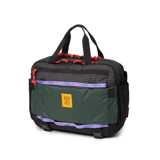 Quarter View of Topo Designs Mountain Cross Bag in "Grid / Very Peri"