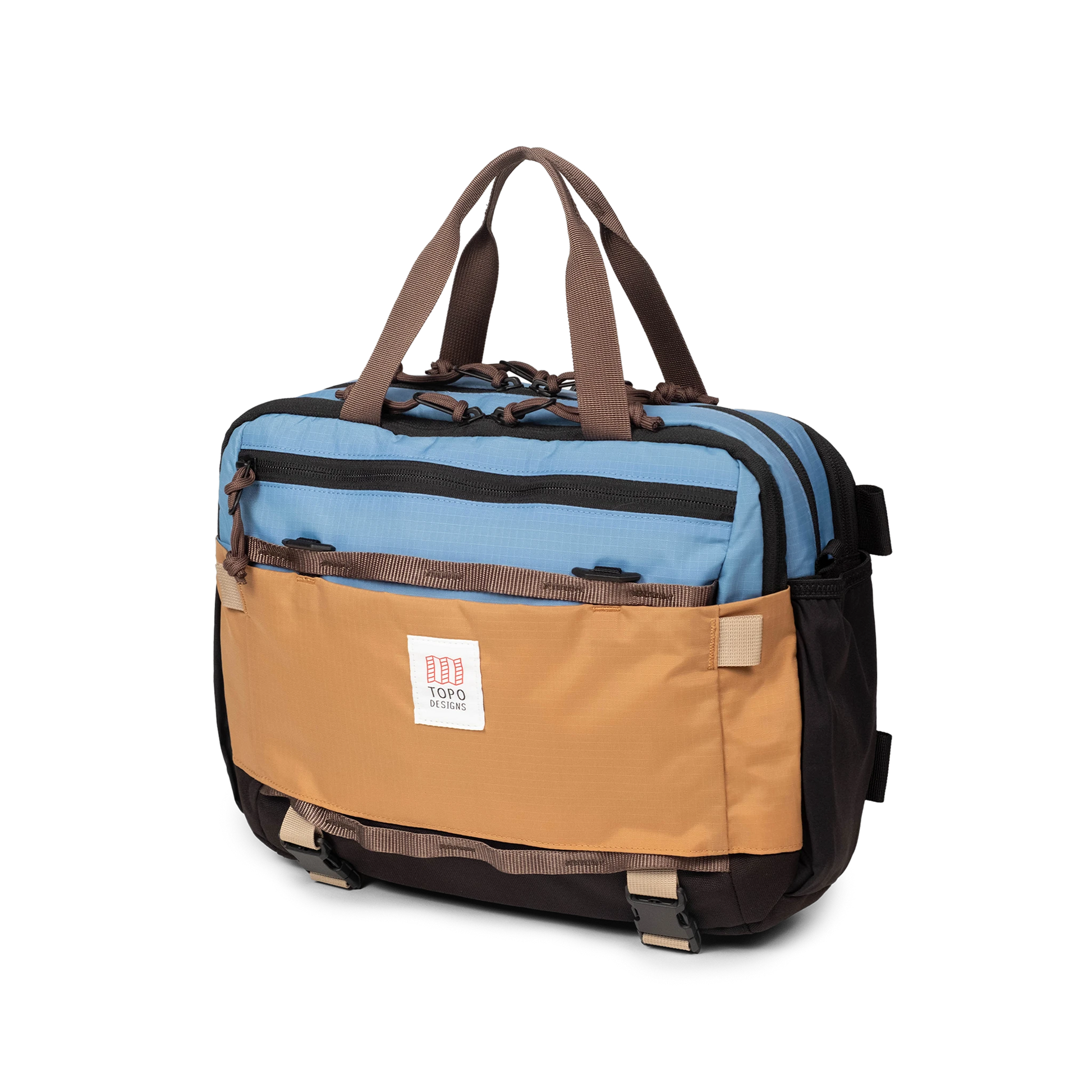 Quarter View of Topo Designs Mountain Cross Bag in "River Blue / Brown Oak"