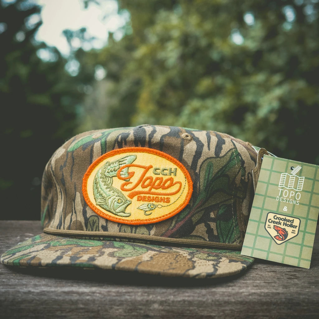 Outside detail shot of Topo Designs x CCH x Pine Printshop Rope Cap in "Mossy Oak Greenleaf"