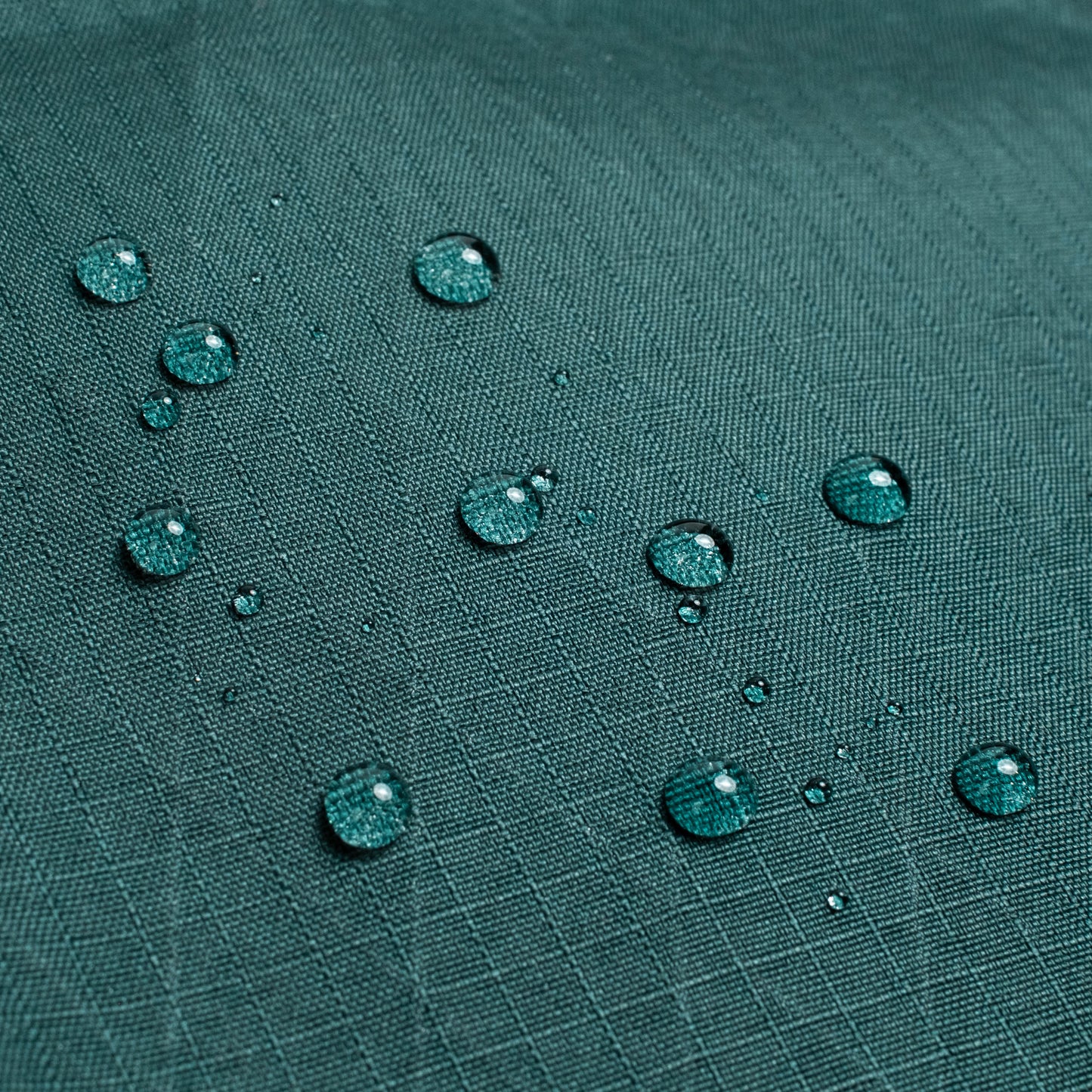 General shot of Topo Designs Global Pro Backpack showing detail shot of water droplets on waterproof material