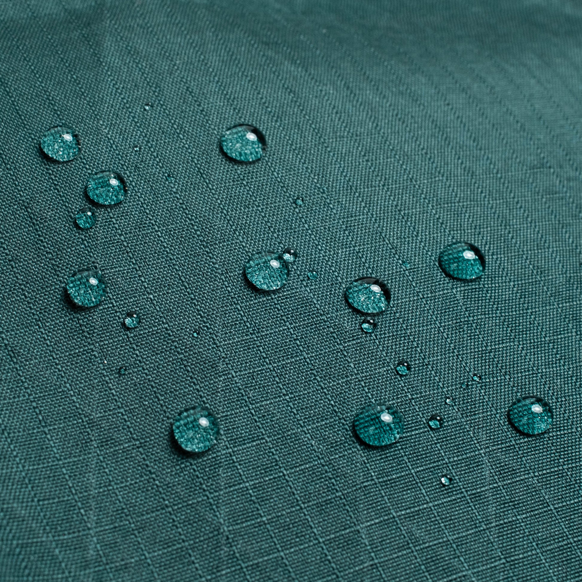 General shot of Topo Designs Global Pro Backpack showing detail shot of water droplets on waterproof material