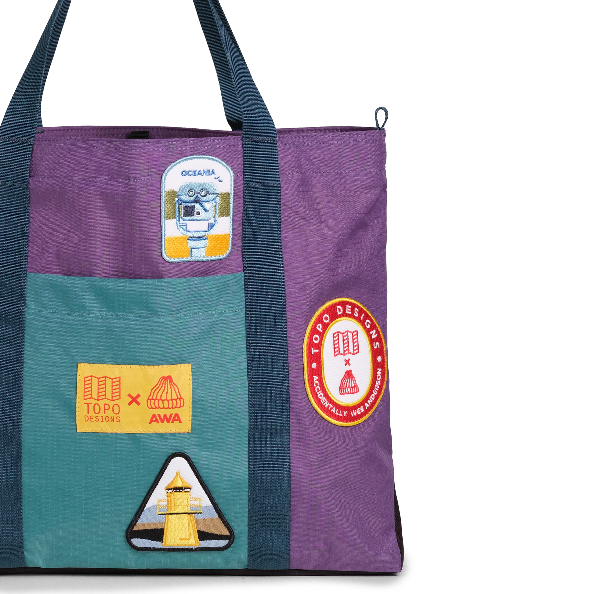 Front exterior detail image of Topo Designs x AWA Mountain Essential Tote in "Loganberry / Caribbean"