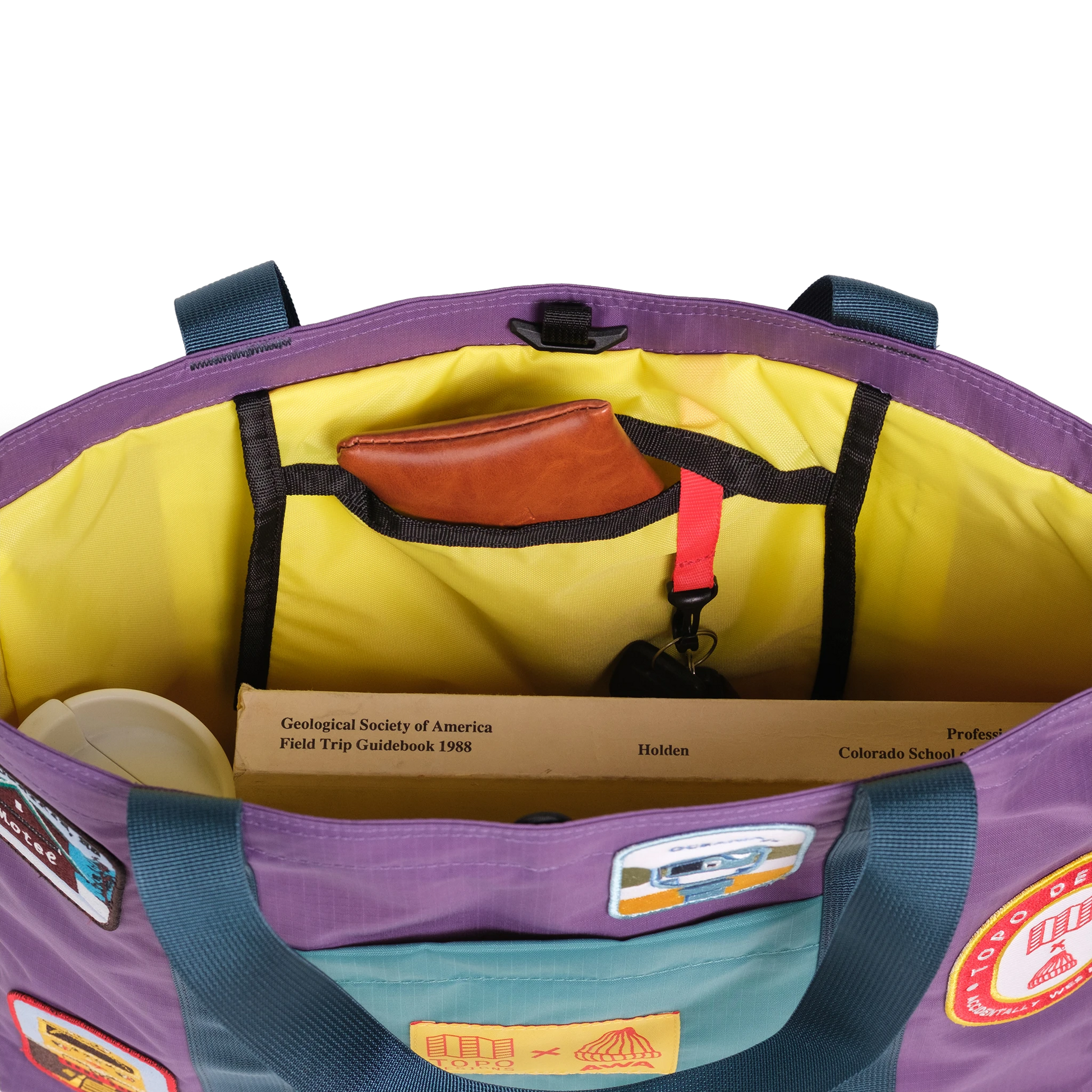 Interior detail image of Topo Designs x AWA Mountain Essential Tote in "Loganberry / Caribbean"
