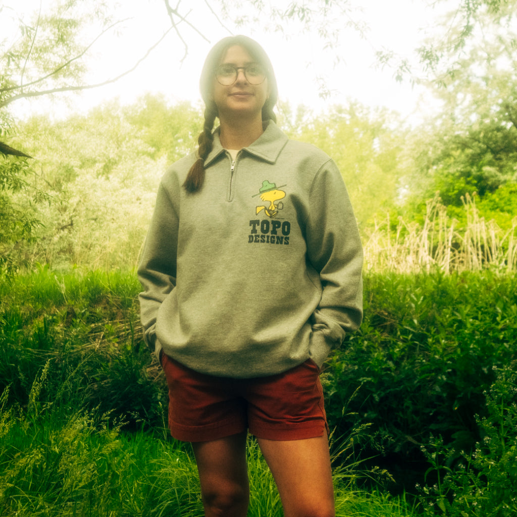 General lifestyle image of Topo Designs x TSPTR Woodstock 1/4 Zip in "Grey Marl"