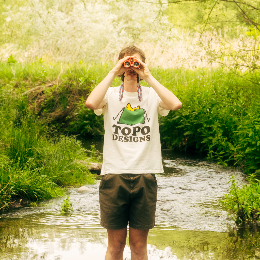 General lifestyle image of Topo Designs x TSPTR Tent Tee in "White"