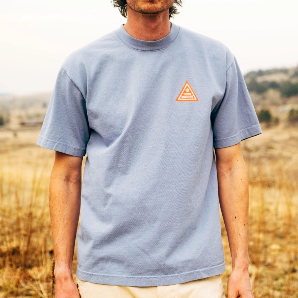 General front image of Topo Designs x Pine Printshop Proceed Slow Tee in "Clear Blue"
